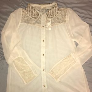 Sheer, cream colored Buckle button up